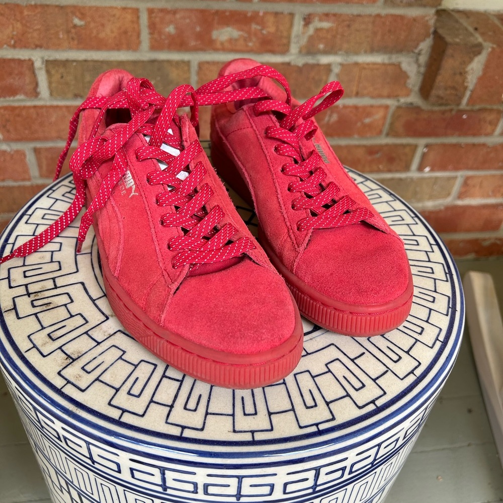 Red suede Puma sneakers
